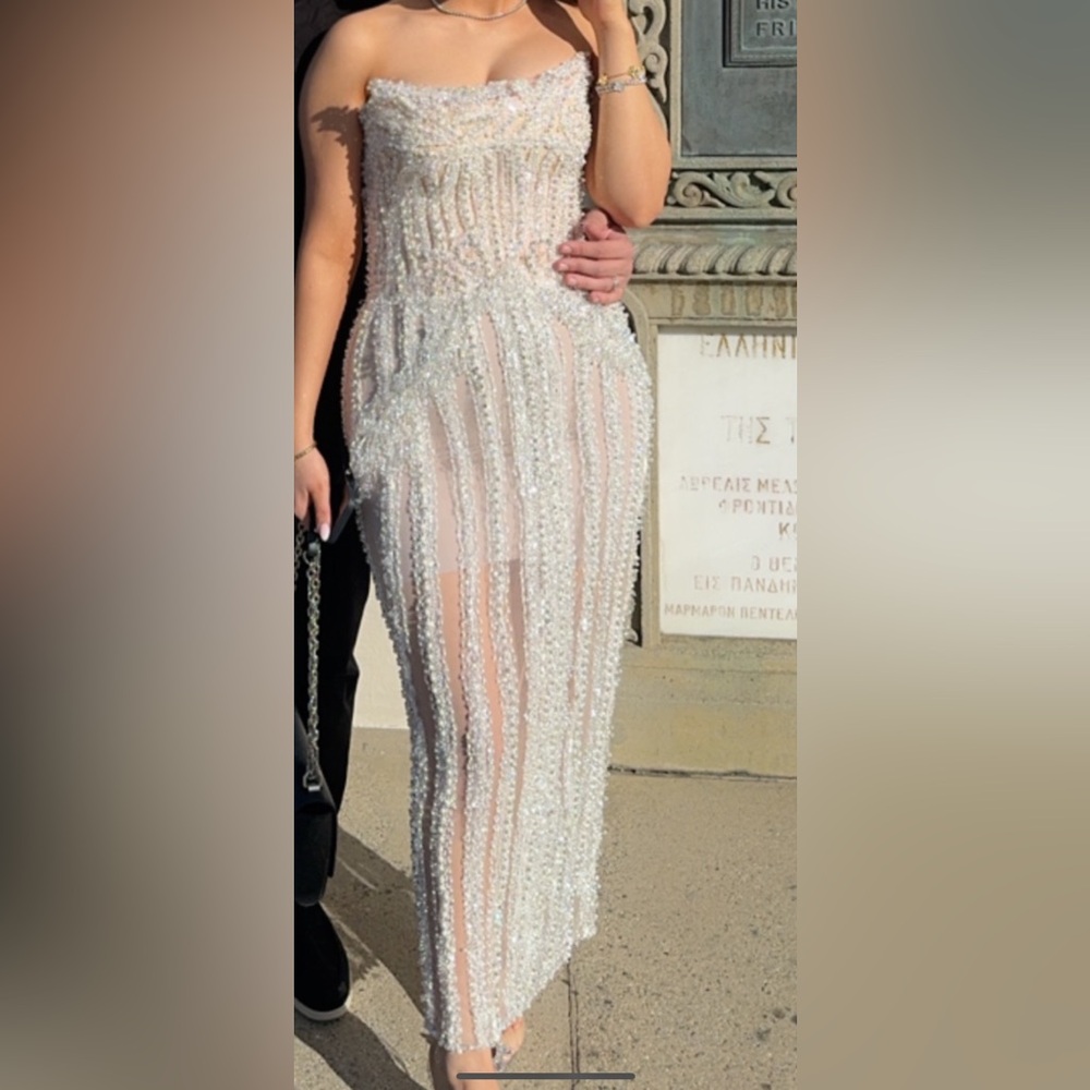 Evening gown dress worn only once to a wedding .